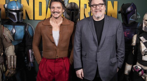 Pedro Pascal, left, and Jon Favreau pose for photographers during a photo call to promote the TV series 'The Mandalorian' in London, Wednesday, Feb. 22, 2023. (Photo by Vianney Le Caer/Invision/AP)