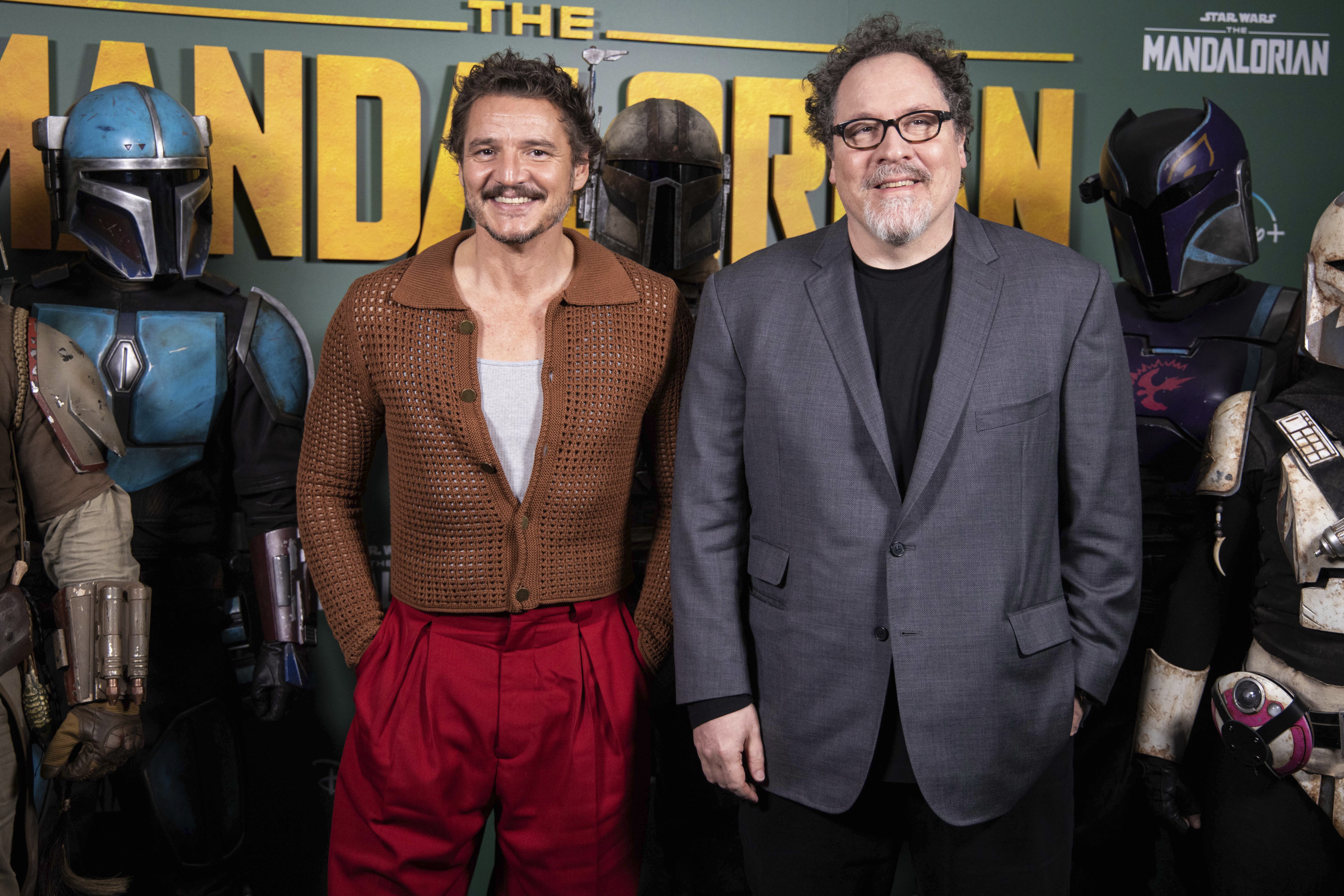Pedro Pascal, left, and Jon Favreau pose for photographers during a photo call to promote the TV series 'The Mandalorian' in London, Wednesday, Feb. 22, 2023. (Photo by Vianney Le Caer/Invision/AP)