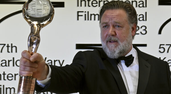 Actor Russell Crowe poses with Crystal Globe award for contribution to world cinema after the opening ceremony of the 57th Karlovy Vary International Film Festival (KVIFF), on June 30, 2023, at the Thermal Hotel in Karlovy Vary, Czech Republic. Photo/Slavomir Kubes (CTK via AP Images)