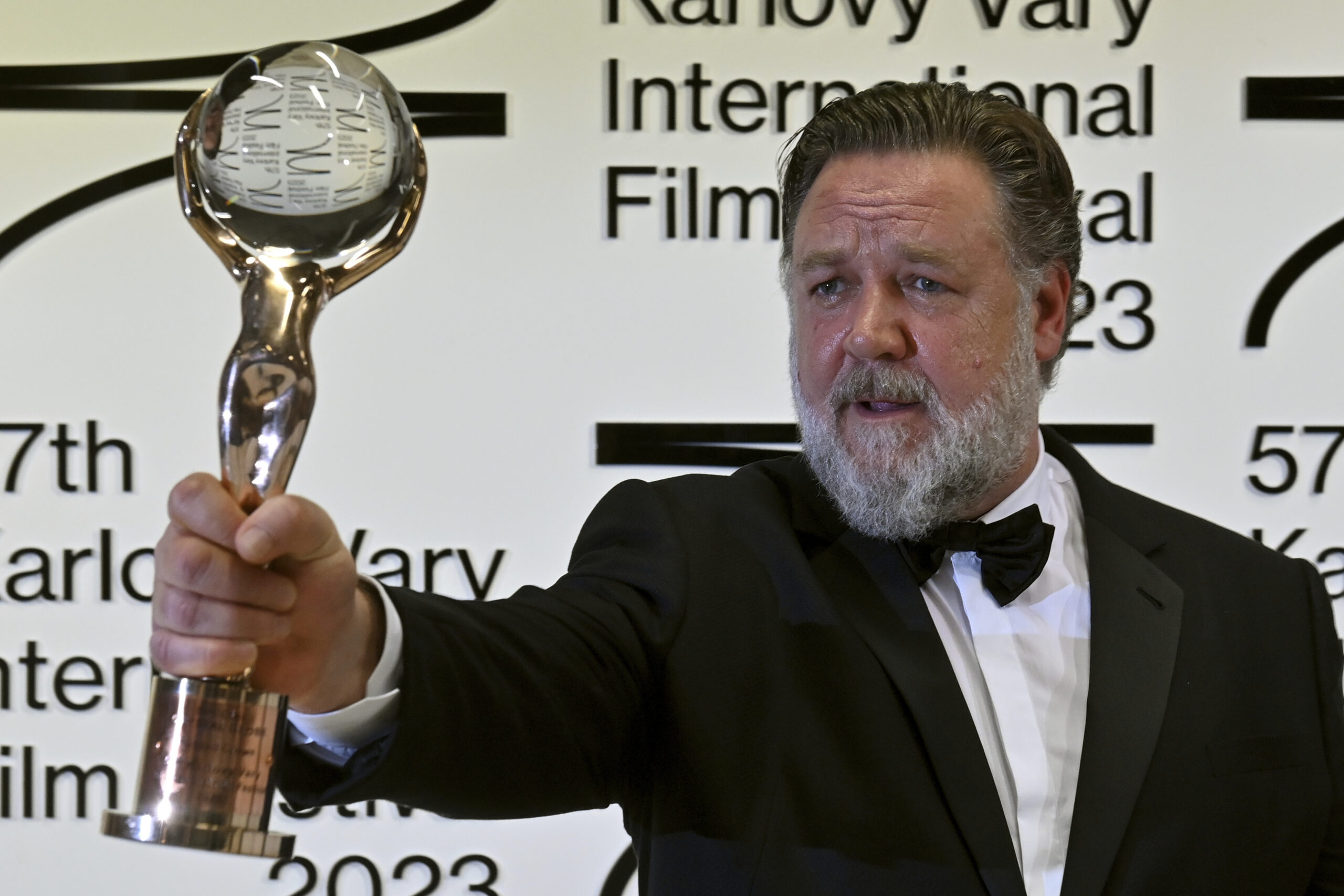 Actor Russell Crowe poses with Crystal Globe award for contribution to world cinema after the opening ceremony of the 57th Karlovy Vary International Film Festival (KVIFF), on June 30, 2023, at the Thermal Hotel in Karlovy Vary, Czech Republic. Photo/Slavomir Kubes (CTK via AP Images)