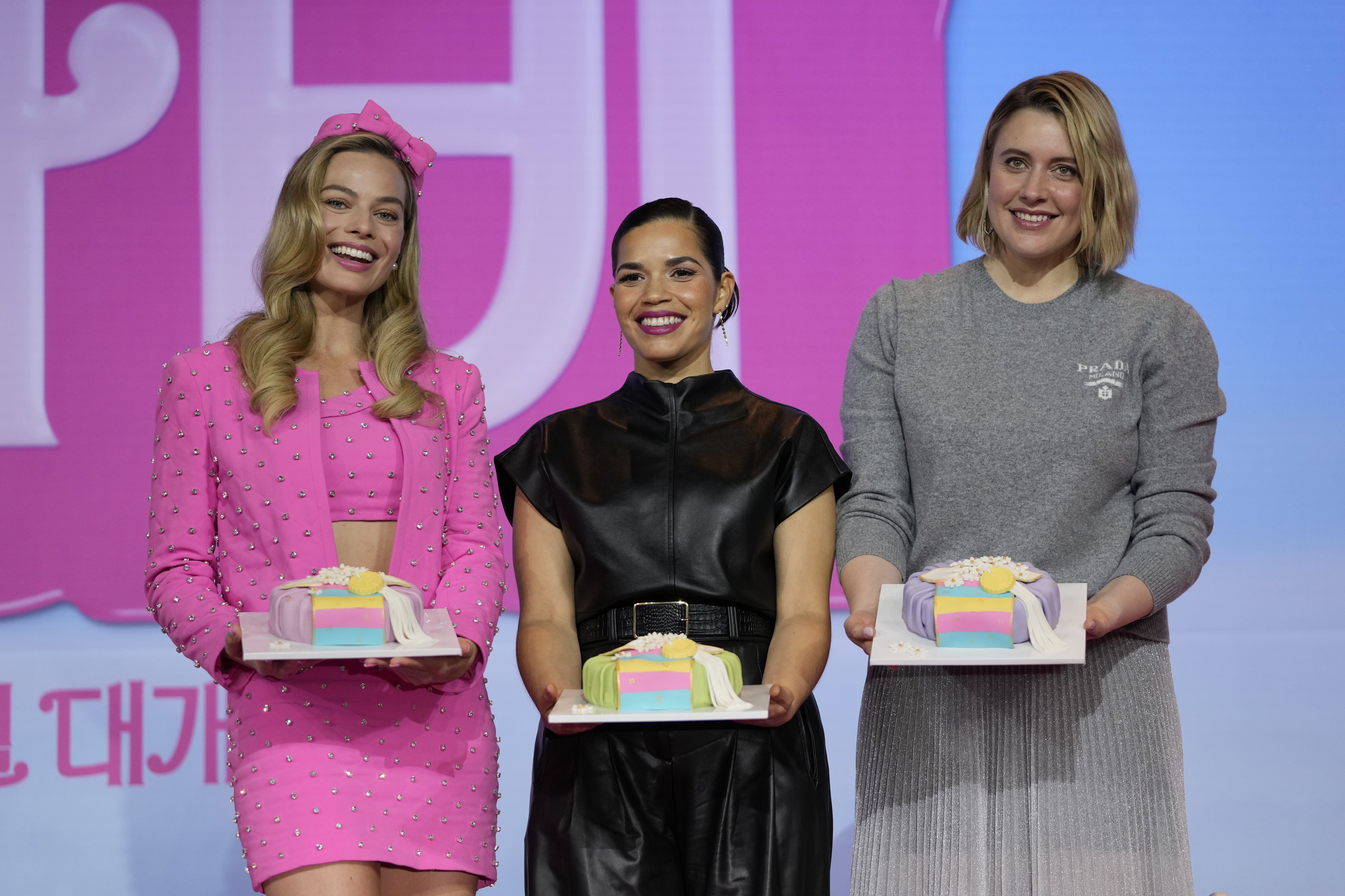 Cast members Margot Robbie, America Ferrera, and director Greta Gerwig, from left to right, pose for the media after a news conference of the movie "Barbie." in Seoul, South Korea, Monday, July 3, 2023. The film is to be released in the country on July 19. (AP Photo/Lee Jin-man)