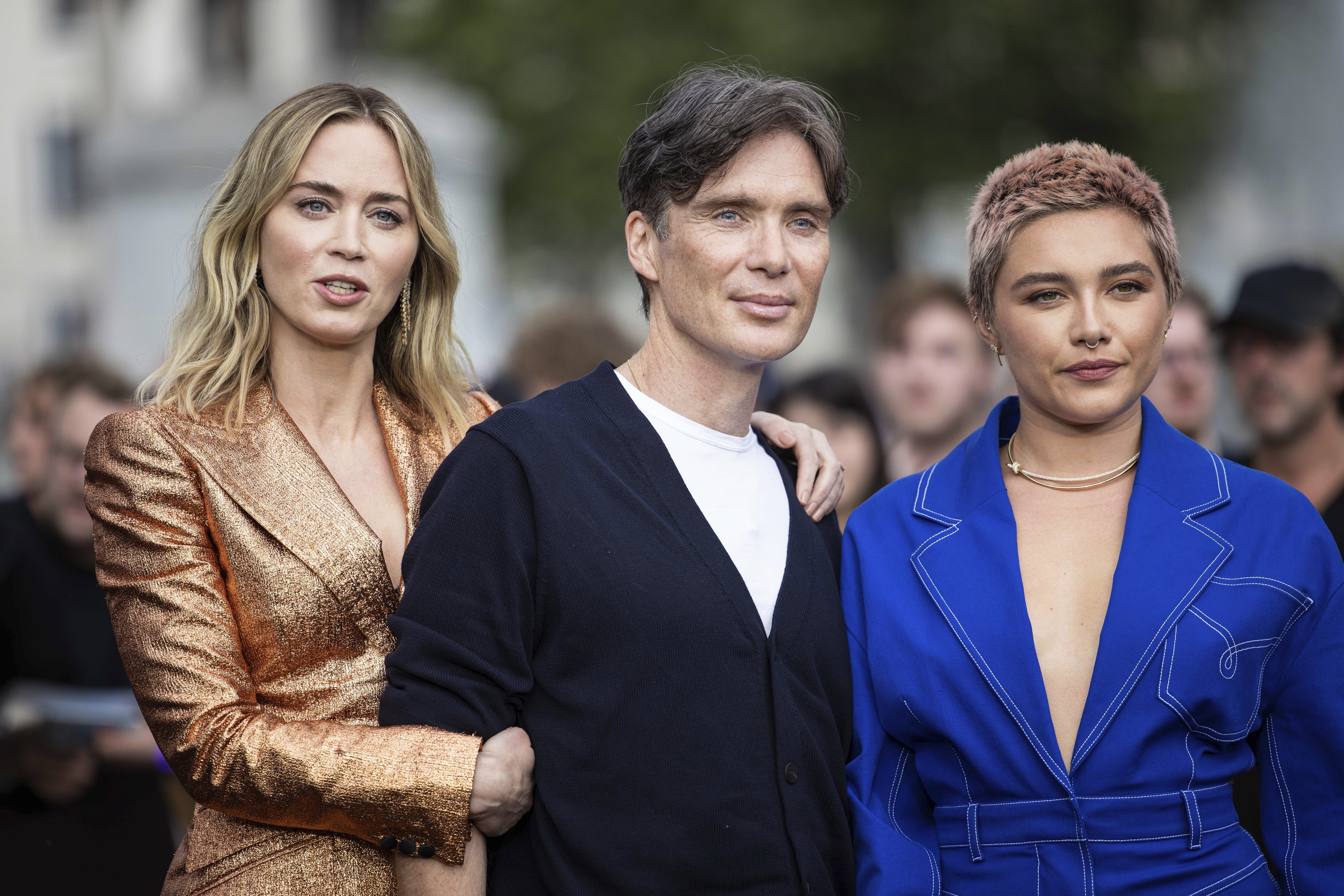 Cillian Murphy, Emily Blunt and Florence Pugh pose for photographers at the photo call for the film 'Oppenheimer' on Wednesday, July 12, 2023 in London. (Vianney Le Caer/Invision/AP)