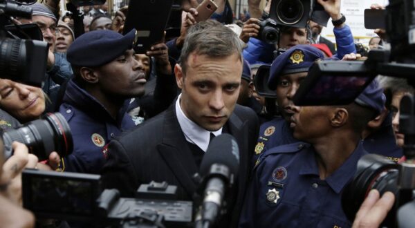 FILE - Oscar Pistorius leaves the High Court in Pretoria, South Africa, on June 14, 2016 during his trail for the murder of girlfriend Reeva Steenkamp. Oscar Pistorius is due on Friday, Jan. 5, 2024 to be released from prison on parole to live under strict conditions at a family home after serving nearly nine years of his murder sentence for the shooting death of girlfriend Reeva Steenkamp on Valentine’s Day 2013. (AP Photo/Themba Hadebe, File)