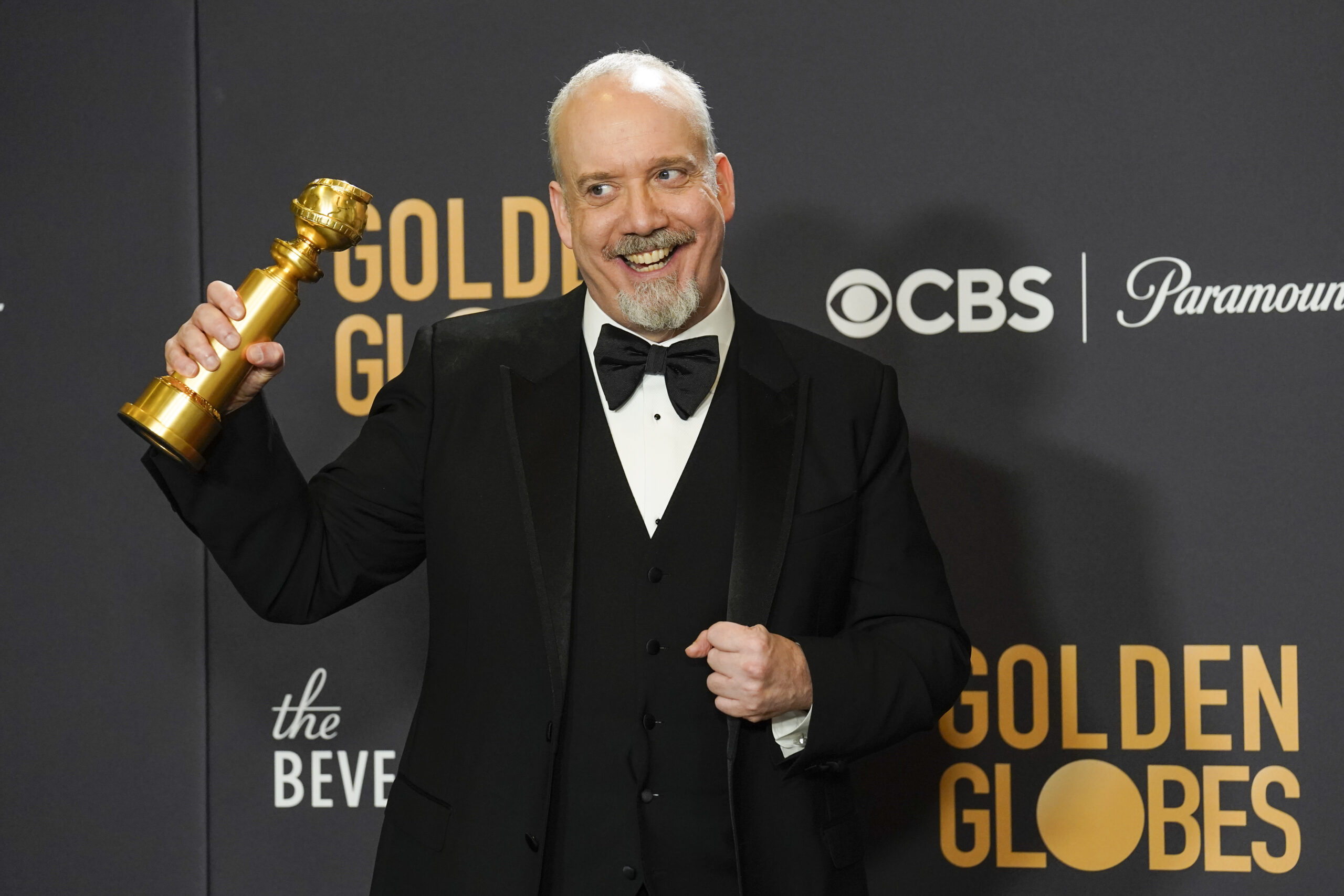 Paul Giamatti poses in the press room with the award for best performance by an actor in a motion picture, musical or comedy for "The Holdovers" at the 81st Golden Globe Awards on Sunday, Jan. 7, 2024, at the Beverly Hilton in Beverly Hills, Calif. (AP Photo/Chris Pizzello)