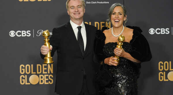 Christopher Nolan, left, and Emma Thomas pose in the press room with the award for best director, motion picture for "Oppenheimer" at the 81st Golden Globe Awards on Sunday, Jan. 7, 2024, at the Beverly Hilton in Beverly Hills, Calif. (AP Photo/Chris Pizzello)