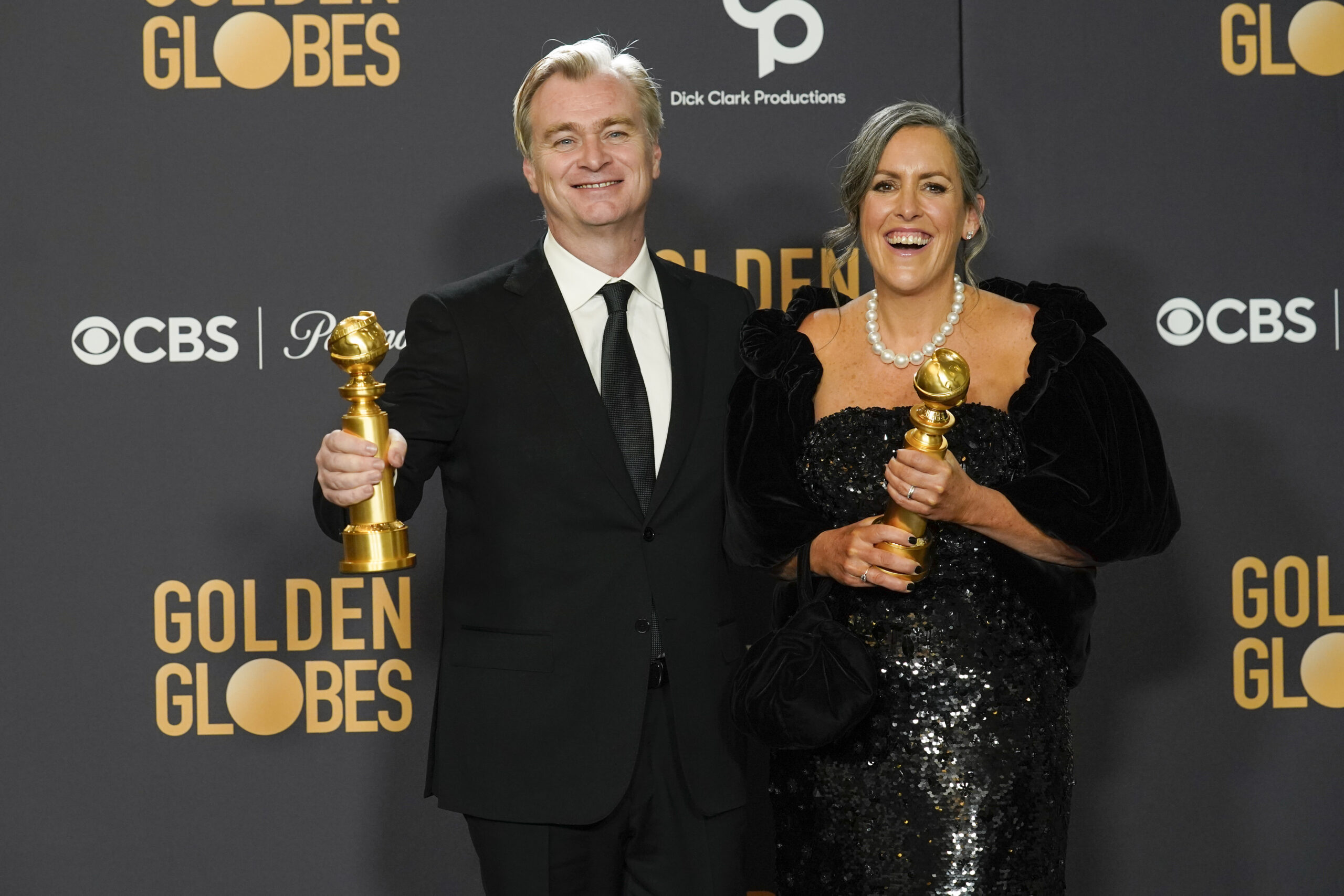 Christopher Nolan, left, and Emma Thomas pose in the press room with the award for best director, motion picture for "Oppenheimer" at the 81st Golden Globe Awards on Sunday, Jan. 7, 2024, at the Beverly Hilton in Beverly Hills, Calif. (AP Photo/Chris Pizzello)