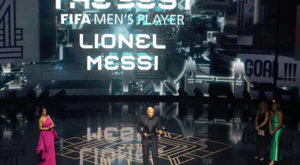 Former France soccer player Thierry Henry accepts on behalf of Argentina's Lionel Messi the Best Men's Player award during the FIFA Football Awards 2023 at the Eventim Apollo in Hammersmith, London, Monday, Jan. 15, 2024. (AP Photo/Kirsty Wigglesworth)