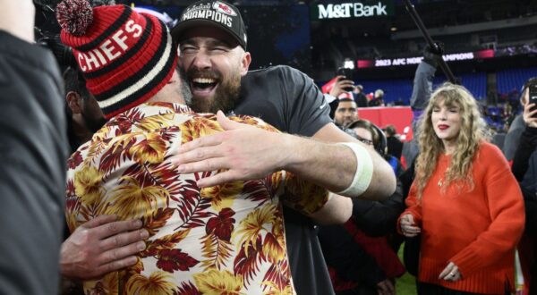 Jason Kelce embraces his brother Kansas City Chiefs tight end Travis Kelce after the AFC Championship NFL football game against the Baltimore Ravens as Taylor Swift watches at right, Sunday, Jan. 28, 2024, in Baltimore. The Chiefs won 17-10. (AP Photo/Nick Wass)