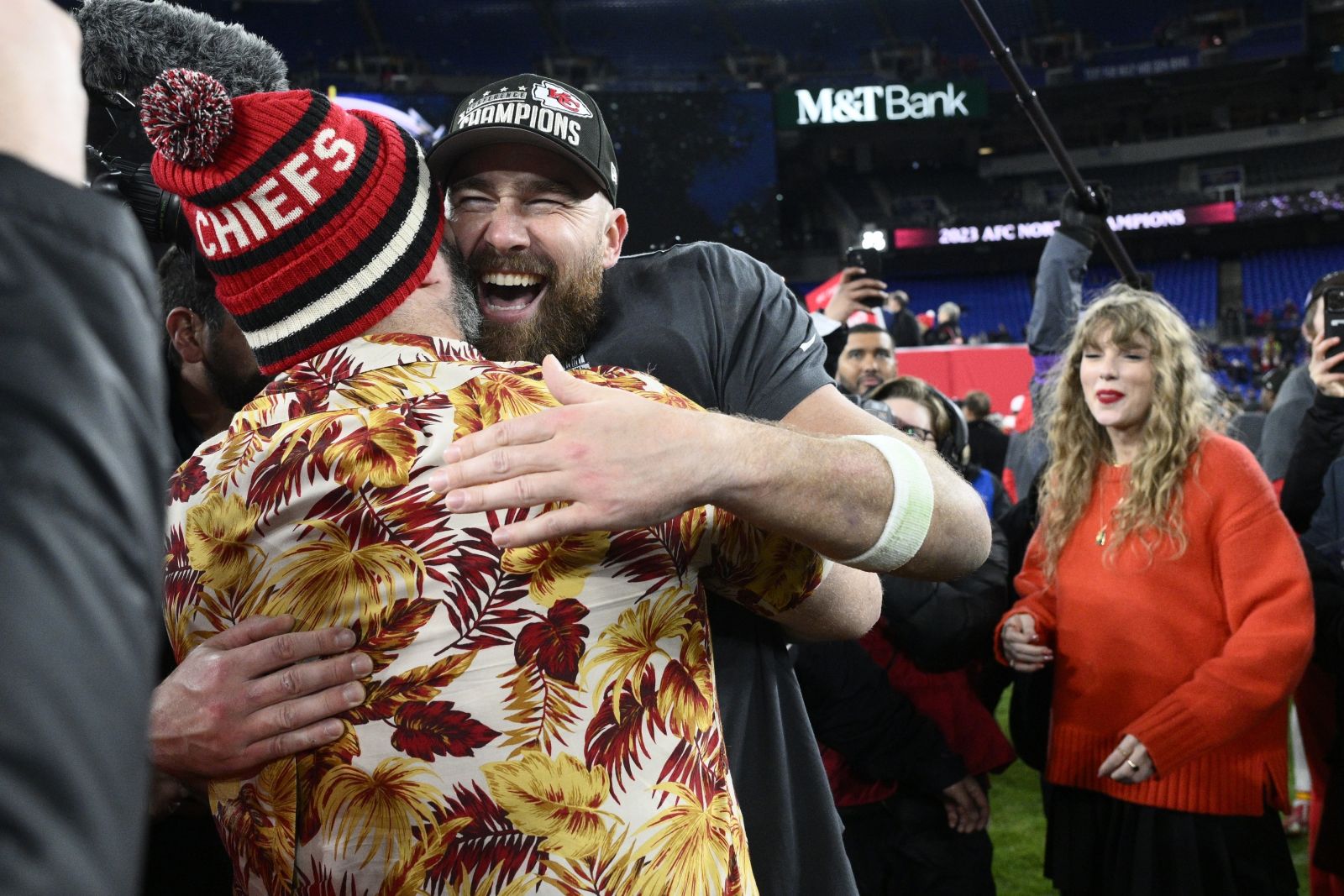 Jason Kelce embraces his brother Kansas City Chiefs tight end Travis Kelce after the AFC Championship NFL football game against the Baltimore Ravens as Taylor Swift watches at right, Sunday, Jan. 28, 2024, in Baltimore. The Chiefs won 17-10. (AP Photo/Nick Wass)
