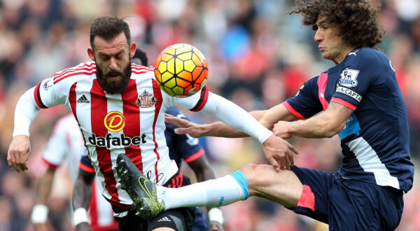 FILE- In this Oct. 25, 2015 file photo, Sunderland's Steven Fletcher, left, vies for the ball with Newcastle United's captain Fabricio Coloccini, during their English Premier League soccer match between Sunderland and Newcastle United at the Stadium of Light, Sunderland, England. By coincidence, several European leagues have derby matches between neighboring teams on Sunday. (AP Photo/Scott Heppell, File)