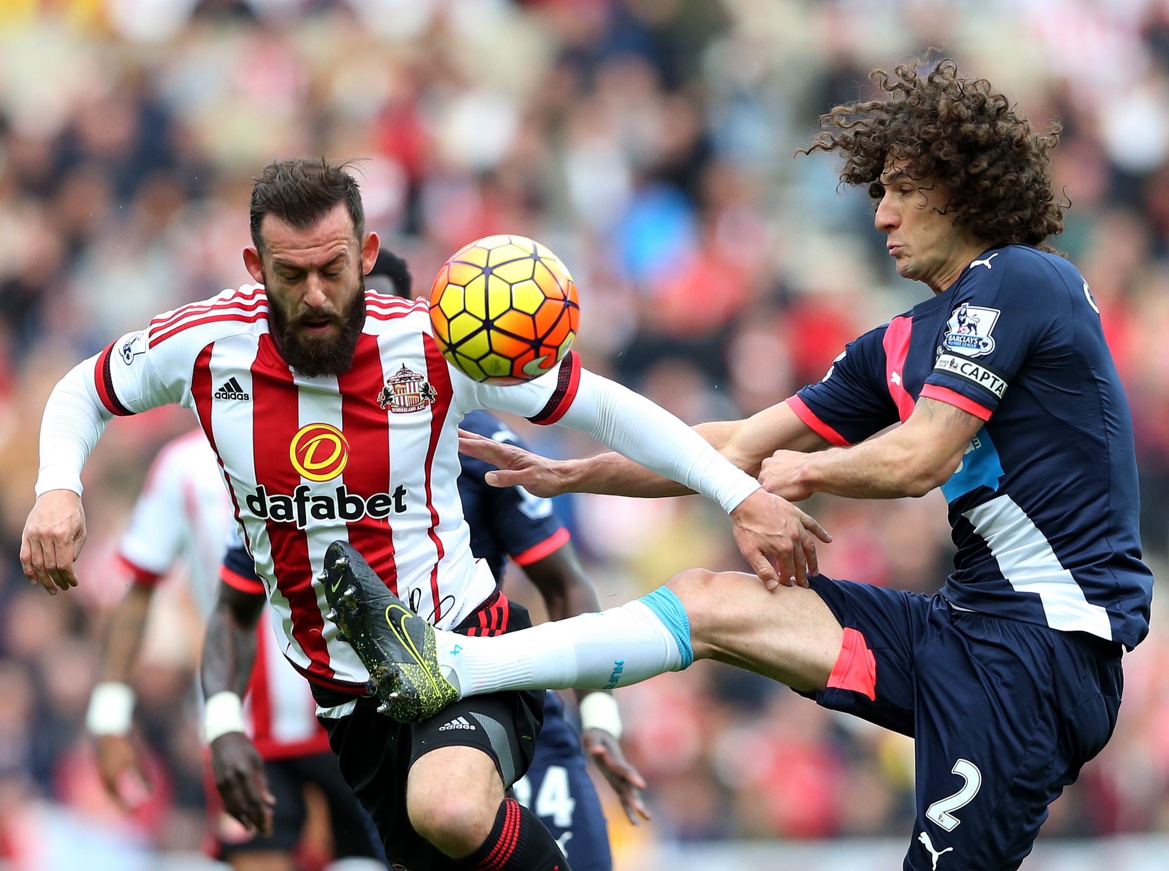 FILE- In this Oct. 25, 2015 file photo, Sunderland's Steven Fletcher, left, vies for the ball with Newcastle United's captain Fabricio Coloccini, during their English Premier League soccer match between Sunderland and Newcastle United at the Stadium of Light, Sunderland, England. By coincidence, several European leagues have derby matches between neighboring teams on Sunday. (AP Photo/Scott Heppell, File)