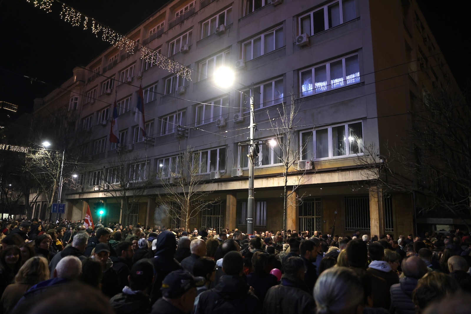 epa11044217 Opposition supporters gather during a protest in front of the Serbian Electoral commission in Belgrade, Serbia, 25 December 2023. Early official vote count after the Parliamentary and local elections on 17 December 2023 confirmed that the Serbian Progressive Party (SNS) had won the election in Serbia and secured a majority in the Parliament, but tensions grew high after the opposition reported irregularities in the capital Belgrade and called their supporters to protest in front of the Electoral commission.  EPA/ANDREJ CUKIC