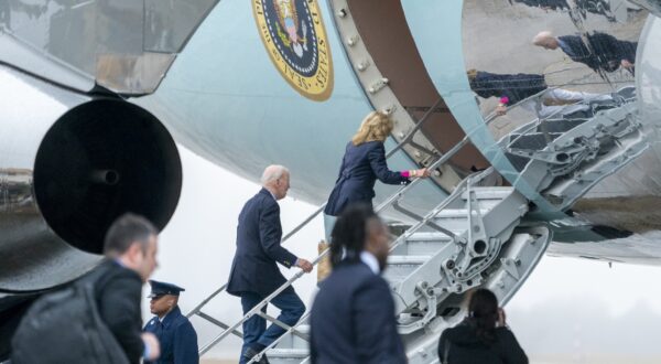 epa11045654 US President Joe Biden (C-L) and First Lady Jill Biden (C-R) board Air Force One on the tarmac at Joint Base Andrews, Maryland, USA, 27 December 2023. President Biden and the First Lady will travel to St. Croix, US Virgin Islands where they will remain through the New Year's holiday.  EPA/SHAWN THEW / POOL