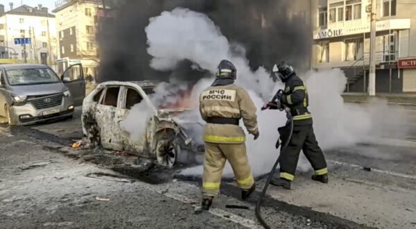 epa11049538 A handout photo made available by the Russian Emergency Ministry press service shows Russian firefighters extinguishing a burning car after shelling in Belgorod, Russia, 30 December 2023. 12 adults and two children were killed due to shelling by the Ukrainian Armed Forces, the press service of the Russian Ministry of Emergency Situations reported 30 December. On 24 February 2022, Russian troops entered Ukrainian territory in what the Russian president declared a 'Special Military Operation', starting an armed conflict that has provoked destruction and a humanitarian crisis.  EPA/RUSSIAN EMERGENCIES MINISTRY HANDOUT  HANDOUT EDITORIAL USE ONLY/NO SALES HANDOUT EDITORIAL USE ONLY/NO SALES