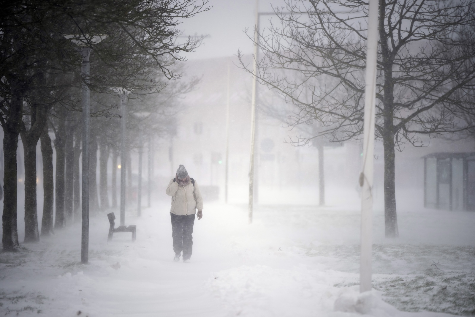 epa11054971 A person walks on the street during a heavy snowfall in Randers, Denmark, 03 January 2024.  EPA/Bo Amstrup  DENMARK OUT
