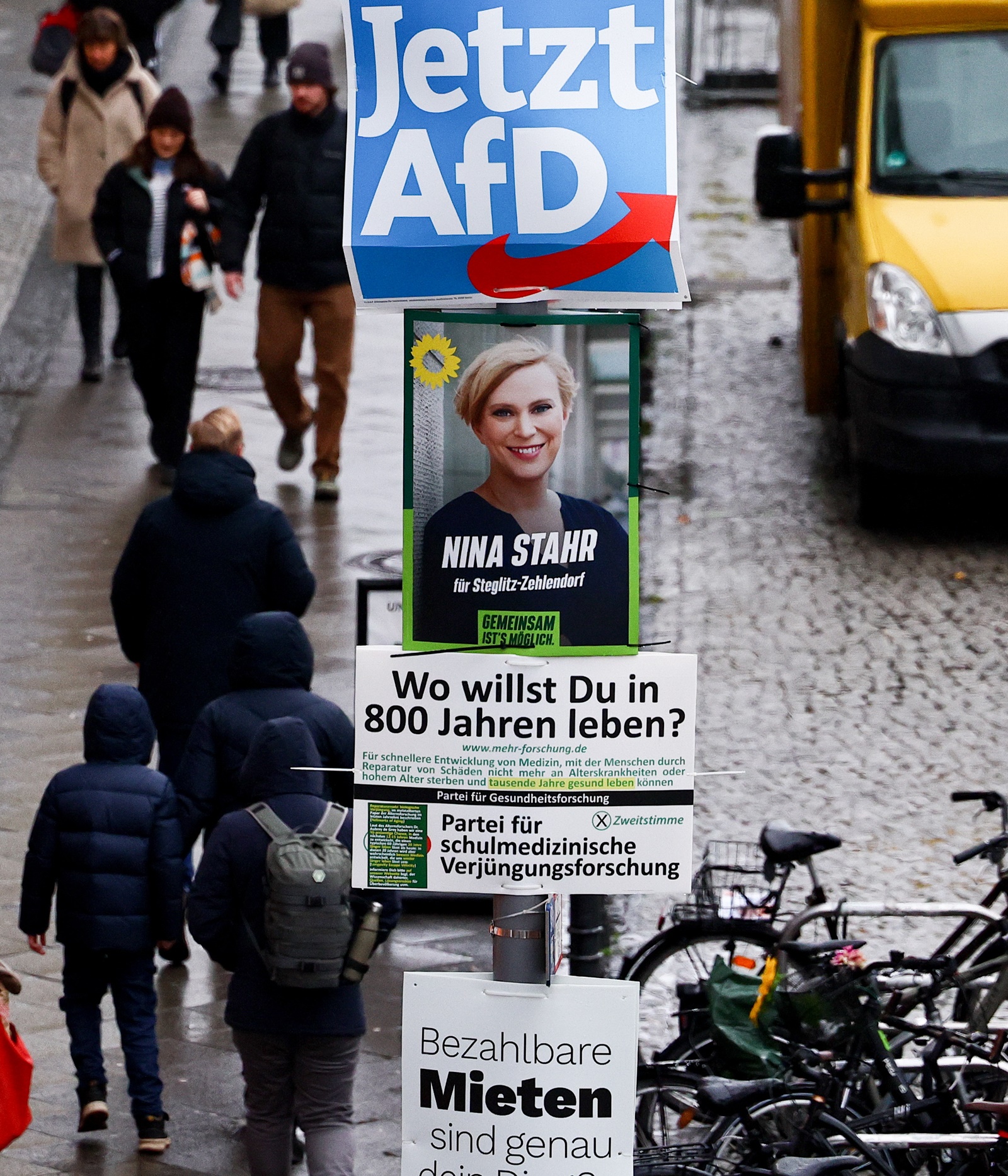 epa11058961 A campaign poster of the right-wing Alternative for Germany (Alternative fuer Deutschland, AfD) party, reading 'Now AfD!', hangs next to a campaign poster of the Green party Alliance 90 / The Greens (Buendnis 90/ Die Gruenen) on a lamp post in Steglitz district in Berlin, Germany, 05 January 2024. On 19 December 2023, the German Federal Constitutional Court ruled that the election to the 20th German Bundestag must be repeated in 455 Berlin constituencies. The date for the partial election rerun is 11 February 2024.  EPA/FILIP SINGER