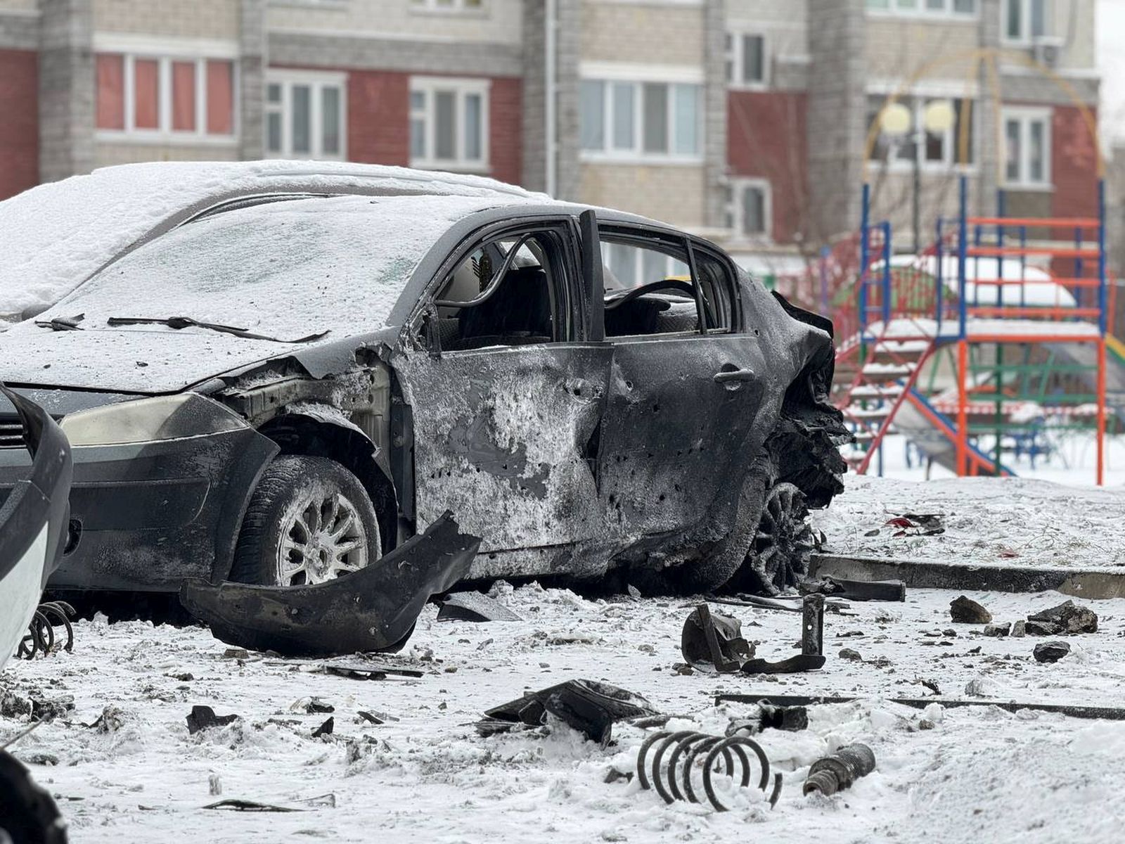 epa11059013 A handout image made available by the official telegram channel of the Belgorod region governor Vyacheslav Gladkov shows destroyed cars after shelling in Belgorod, Russia, 05 January 2024. Two people were injured due to shelling by the Ukrainian Armed Forces, the Mayor of Belgorod Valentin Demidov wrote on telegram. On 24 February 2022, Russian troops entered Ukrainian territory in what the Russian president declared a 'special military operation', starting an armed conflict that has provoked destruction and a humanitarian crisis.  EPA/BELGOROD REGION GOVERNOR MANDATORY CREDIT / HANDOUT EDITORIAL USE ONLY/NO SALES HANDOUT EDITORIAL USE ONLY/NO SALES HANDOUT EDITORIAL USE ONLY/NO SALES