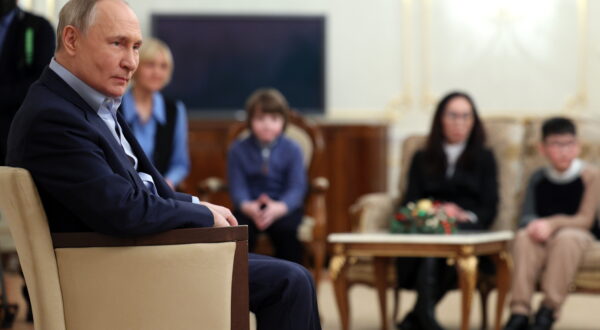 epa11061723 Russian President Vladimir Putin (L) meets with family members of servicemen, who died during a 'special military operation' at Novo-Ogaryovo residence outside Moscow, Russia, 06 January 2024.  EPA/GAVRIIL GRIGOROV / SPUTNIK / KREMLIN POOL MANDATORY CREDIT