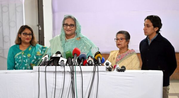 epa11062520 A handout photo made available by the Bangladesh prime minister's office shows Bangladesh Prime Minister and Awami League President Sheikh Hasina (C) talking to the media after casting her vote at the Dhaka City College polling center during the 12th national general election in Dhaka, Bangladesh, 07 January 2024. The last general election in Bangladesh was held in 2018. People are voting to select members of the national parliament, also known as Jatiya Sangsad.  EPA/BANGLADESH PRIME MINISTER'S OFFICE / HANDOUT  HANDOUT EDITORIAL USE ONLY/NO SALES HANDOUT EDITORIAL USE ONLY/NO SALES