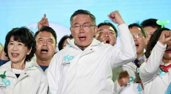 epa11062631 Taiwan People's Party (TPP) presidential candidate Ko Wen-je (C) reacts during a campaign rally in Kaohsiung city, Taiwan, 07 January 2024. Taiwan's presidential election is scheduled to be held on 13 January 2024.  EPA/RITCHIE B. TONGO