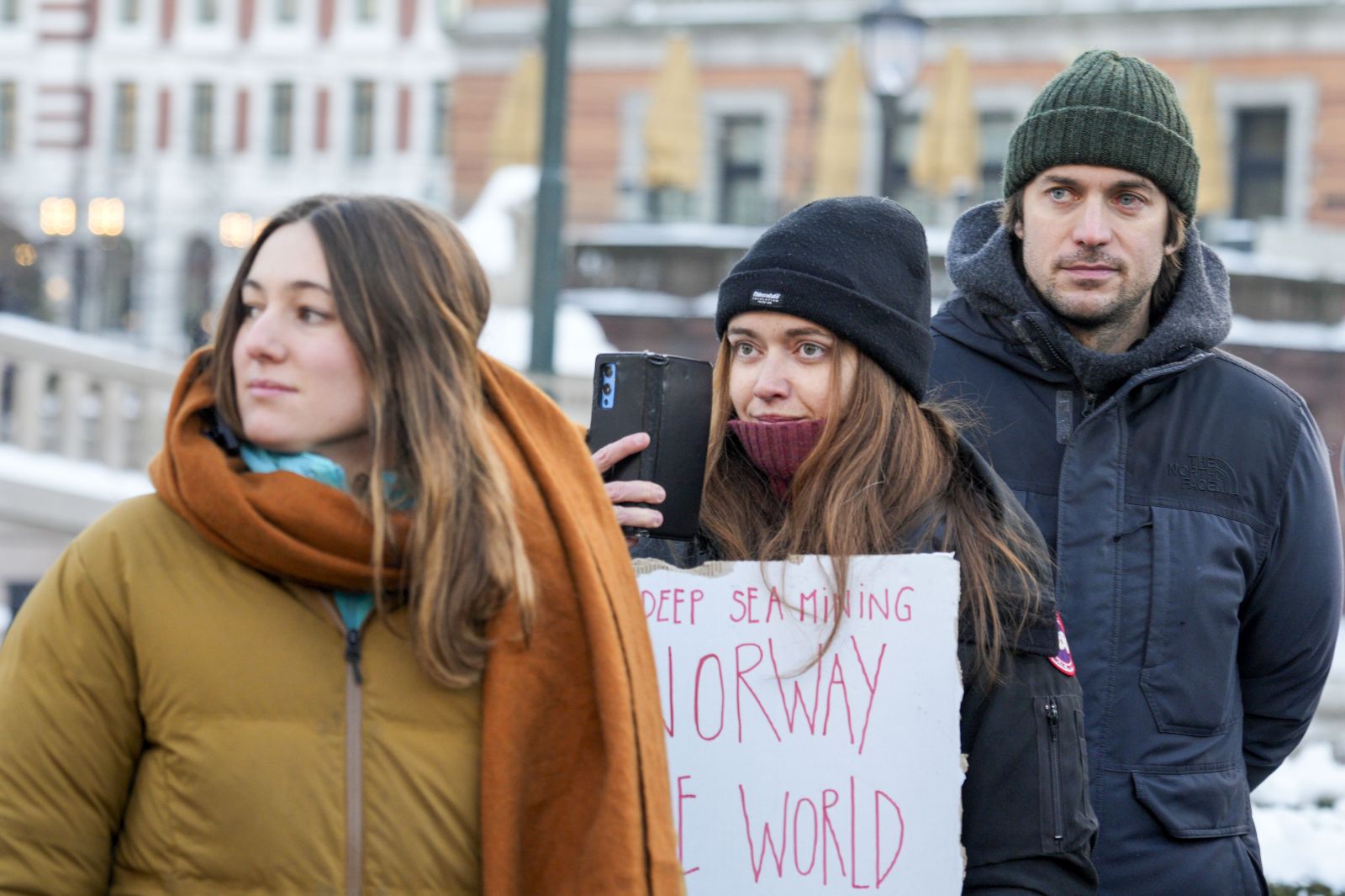 epa11065960 (L-R) French climate activists Camille Etienne and Anne-Sophie Roux, and French actor Lucas Bravo attend a demonstration against seabed mining outside the Norwegian Parliament building in Oslo, Norway, 09 January 2024.  EPA/Javad Parsa  NORWAY OUT