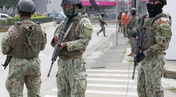 epa11072732 Members of Ecuador Armed Forces stand guard outside TC Television channel during a visit of President Daniel Noboa, in Guayaquil, Ecuador, 12 January 2024. Ecuador is in turmoil after TC Television channel was assaulted by armed men during a live broadcast on January 9, taking hostages of employees on the spot. President Daniel Noboa declared the nation in 'internal armed conflict' after the incident, ordering security forces to 'neutralize' criminal groups accused of spreading violence in the country.  EPA/Carlos DurÃ¡n AraÃºjo