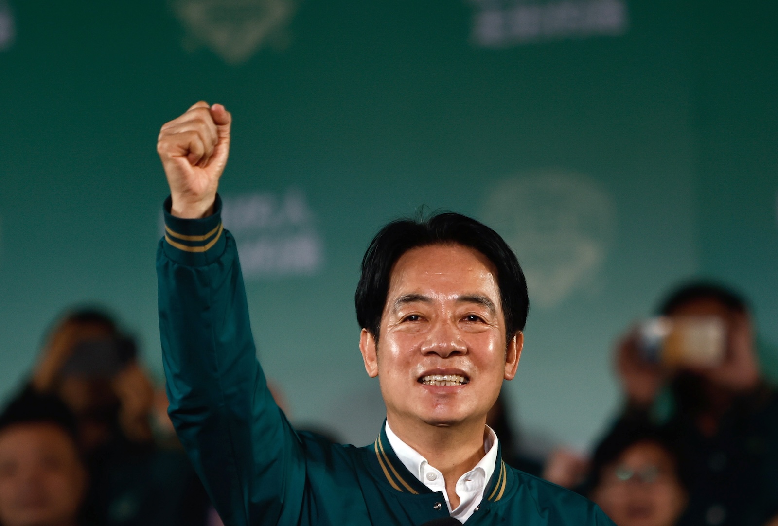 epa11073490 Taiwanese Vice President and ruling Democratic Progressive Party (DPP) presidential candidate William Lai Ching-te gestures during a rally after winning the presidential elections in Taipei, Taiwan, 13 January 2024. DPP's William Lai is set to be Taiwan's next president after his rivals conceded defeat in the Taiwan presidential elections.  EPA/DANIEL CENG