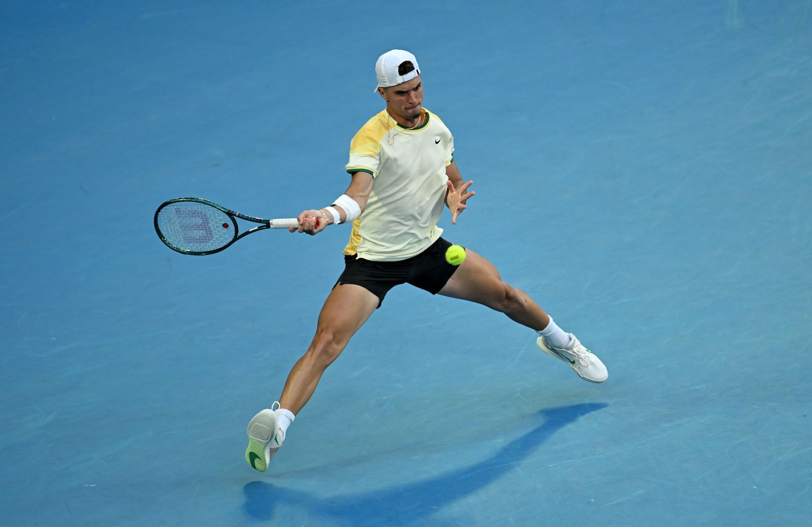 epa11075552 Dino Prizmic of Croatia returns during his first round match against  Novak Djokovic of Serbia on Day 1 of the 2024 Australian Open at Melbourne Park in Melbourne, Australia, 14 January 2024.  EPA/LUKAS COCH AUSTRALIA AND NEW ZEALAND OUT