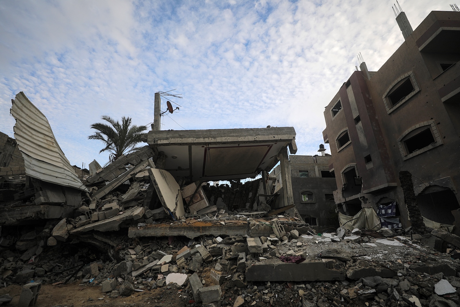 epa11075885 Destroyed Palestinian families' houses following Israeli air strikes in Deir Al Balah refugee camp, Gaza Strip, 13 January 2024 (issued 14 January 2024). 14 January 2024 marks the one-hundredth day since Hamas' attack on Israel. More than 23,600 Palestinians and at least 1,300 Israelis have been killed, according to the Palestinian Health Ministry and the Israel Defense Forces (IDF), since Hamas militants launched an attack against Israel from the Gaza Strip on 07 October, and the Israeli operations in Gaza and the West Bank which followed it.  EPA/MOHAMMED SABER
