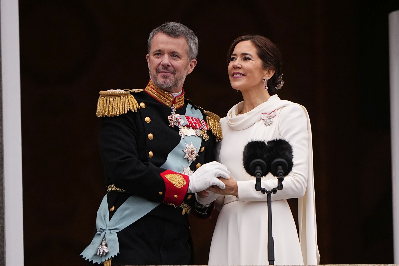 epa11076300 Denmark's King Frederik X (L) and Queen Mary (R) hold hands on the balcony after the proclamation of the accession to the throne at Christiansborg Palace Square in Copenhagen, Denmark, 14 January 2024. Denmark's Queen Margrethe II announced in her New Year's speech on 31 December 2023 that she would abdicate on 14 January 2024, the 52nd anniversary of her accession to the throne. Her eldest son, Crown Prince Frederik, is set to succeed his mother on the Danish throne as King Frederik X. His son, Prince Christian, will become the new Crown Prince of Denmark following his father's coronation.  EPA/BO AMSTRUP DENMARK OUT