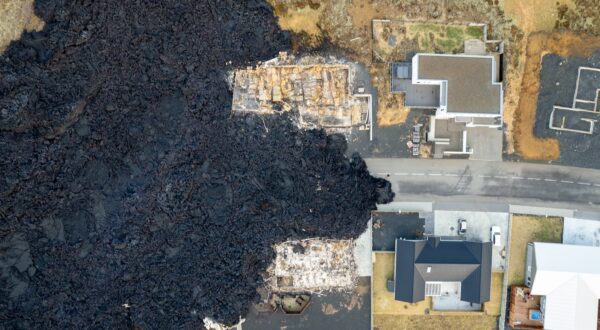 epa11079535 Image taken with a drone showing destroyed builings following lava explosions after a volcanic eruption near the town of Grindavik, in the Reykjanes peninsula, southwestern Iceland, 15 January 2024. A volcanic eruption began north of the town of Grindavik on the Reykjanes peninsula on 14 January, prompting authorities in Iceland to evacuate the small fishing town in the early morning as a precaution. The eruption is not expected to impact additional populated areas and does not present a 'threat to life', the Government of Iceland stated, adding that there are no disruptions to flights to and from Iceland. This is the second eruption in the area since December 2023, and the fifth since 2021.  EPA/ANTON BRINK