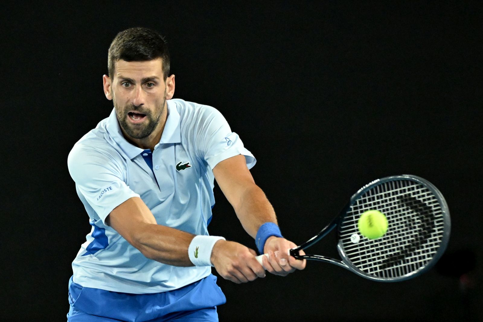 epa11084684 Novak Djokovic of Serbia in action during his round 2 match against Alexei Popyrin of Australia on Day 4 of the 2024 Australian Open at Melbourne Park in Melbourne, Australia, 17 January 2024.  EPA/JAMES ROSS  AUSTRALIA AND NEW ZEALAND OUT