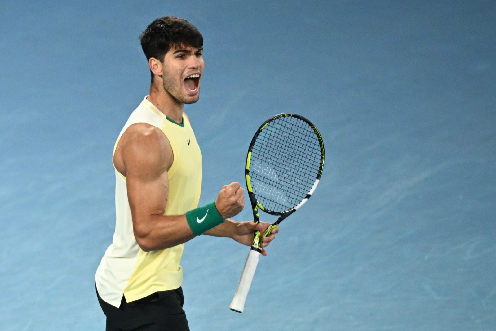 epa11095767 Carlos Alcaraz of Spain celebrates during his 4th round match against Miomir Kecmanovic of Serbia at the 2024 Australian Open in Melbourne, Australia, 22 January 2024.  EPA/JOEL CARRETT AUSTRALIA AND NEW ZEALAND OUT