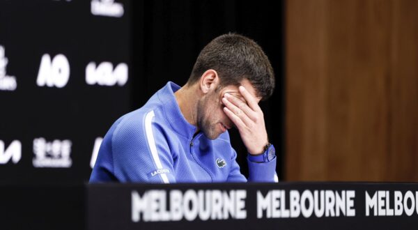 epa11105097 Novak Djokovic of Serbia reacts during a press conference after losing the Men's semi final match against Jannik Sinner of Italy at the Australian Open tennis tournament in Melbourne, Australia, 26 January 2024.  EPA/MAST IRHAM