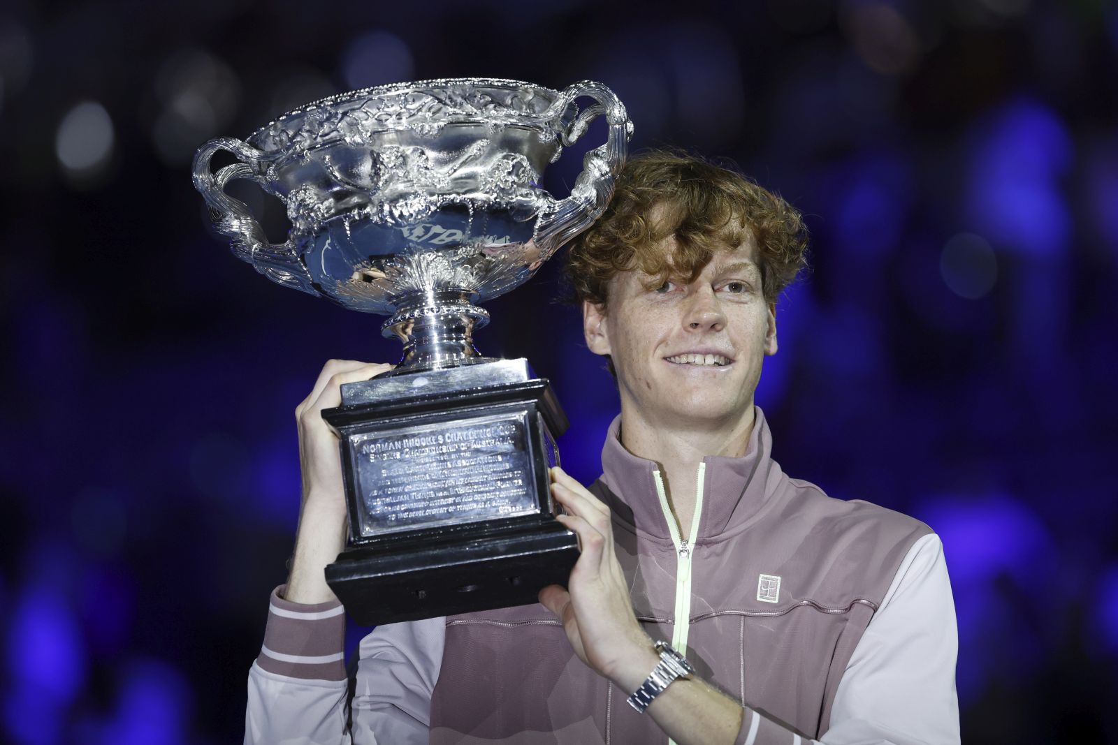 epa11110477 Jannik Sinner of Italy celebrates with the Norman Brookes Challenge Cup trophy after winning the Men's Singles final match against Daniil Medvedev of Russia at the 2024 Australian Open tennis tournament, in Melbourne, Australia, 28 January 2024.  EPA/MAST IRHAM