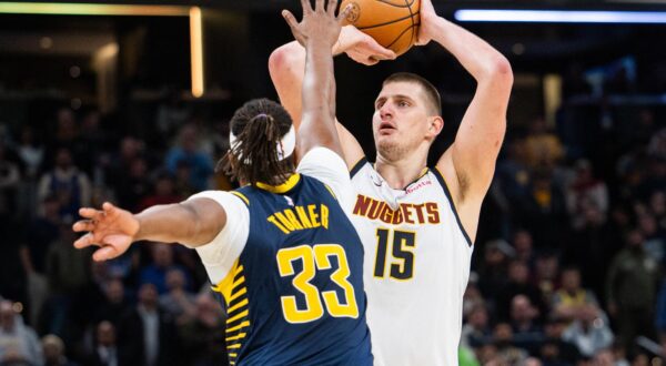Jan 23, 2024; Indianapolis, Indiana, USA; Denver Nuggets center Nikola Jokic (15) shoots the ball while Indiana Pacers center Myles Turner (33) defends in the second half at Gainbridge Fieldhouse. Mandatory Credit: Trevor Ruszkowski-USA TODAY Sports Photo: Trevor Ruszkowski/REUTERS
