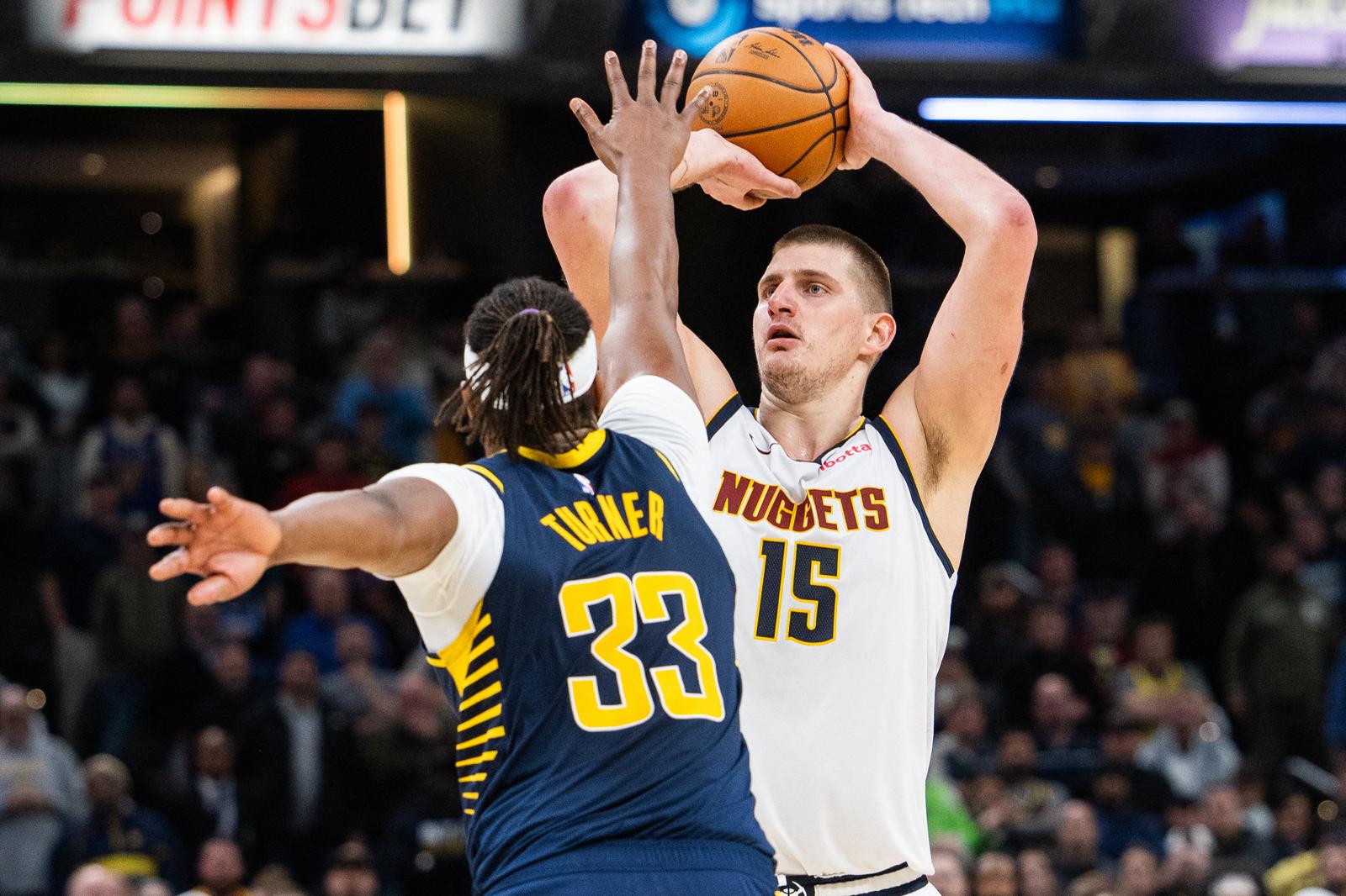 Jan 23, 2024; Indianapolis, Indiana, USA; Denver Nuggets center Nikola Jokic (15) shoots the ball while Indiana Pacers center Myles Turner (33) defends in the second half at Gainbridge Fieldhouse. Mandatory Credit: Trevor Ruszkowski-USA TODAY Sports Photo: Trevor Ruszkowski/REUTERS