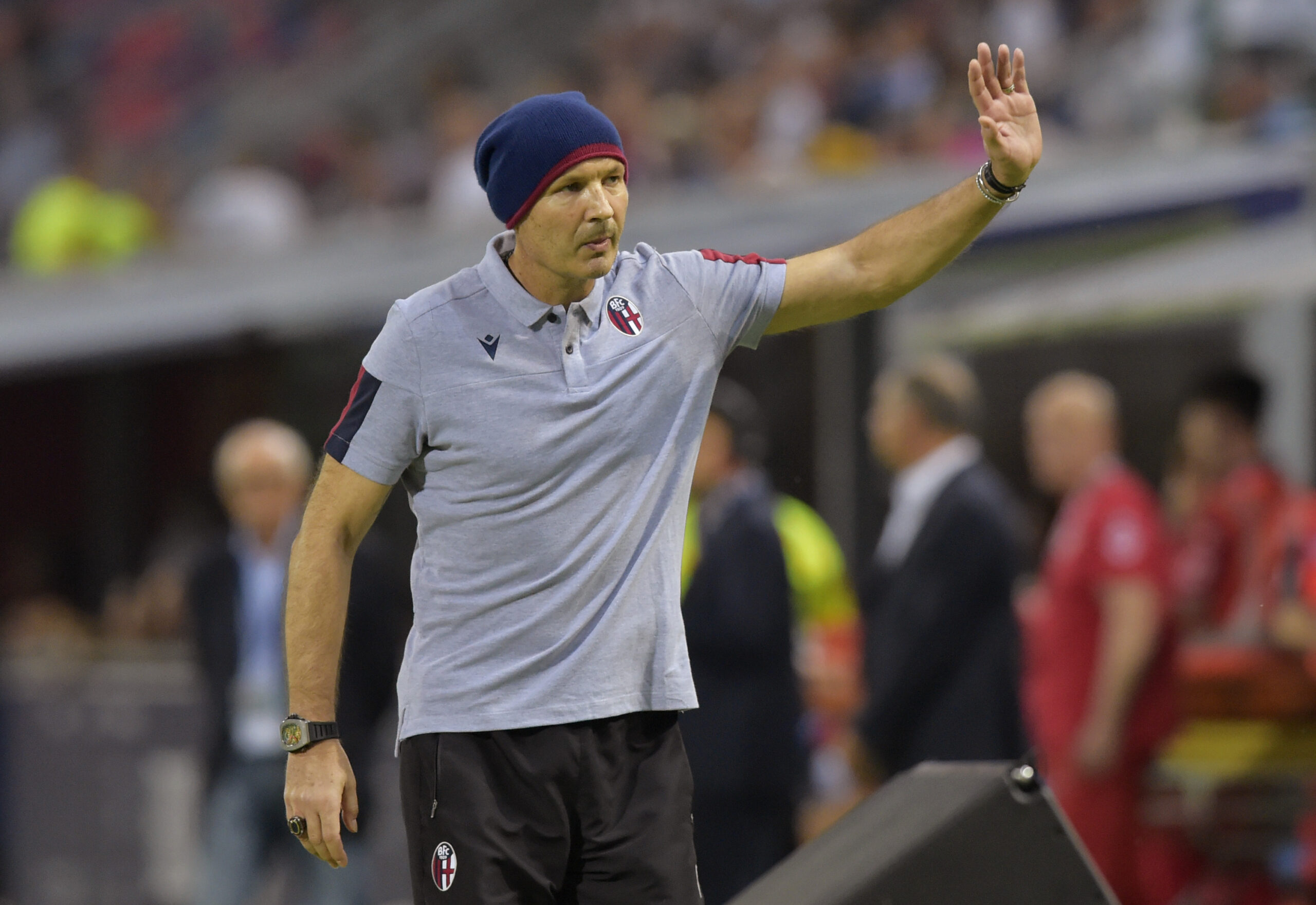 Bologna coach Sinisa Mihajlovic waves supporters during the Serie A soccer match between Bologna and Spal at the Dall'Ara stadium, in Bologna, Italy, Friday, Aug. 30, 2019. (AP Photo/Marco Vasini)