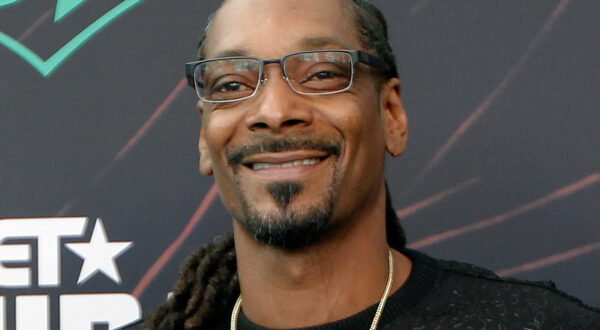 FILE - In this Sept. 17, 2016 file photo, Snoop Dog smiles at the BET Hip Hop Awards in Atlanta. An Israeli start-up that promotes home-grown marijuana says it has signed on American rapper Snoop Dogg as a brand ambassador. Snoop, an outspoken advocate of marijuana use, will promote Seedo’s small refrigerator-like machine that grows cannabis and other plants with the help of artificial intelligence. Snoop started his own line of marijuana products, Leafs by Snoop, in 2015. (AP Photo/Tami Chappell, File)