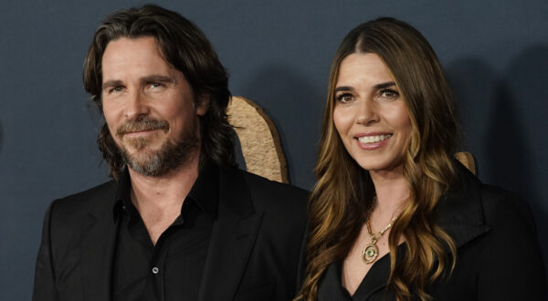 Christian Bale and his wife Sibi Blazic pose together at the premiere of the film "The Pale Blue Eye," Wednesday, Dec. 14, 2022, at the Directors Guild of America in Los Angeles. (AP Photo/Chris Pizzello)