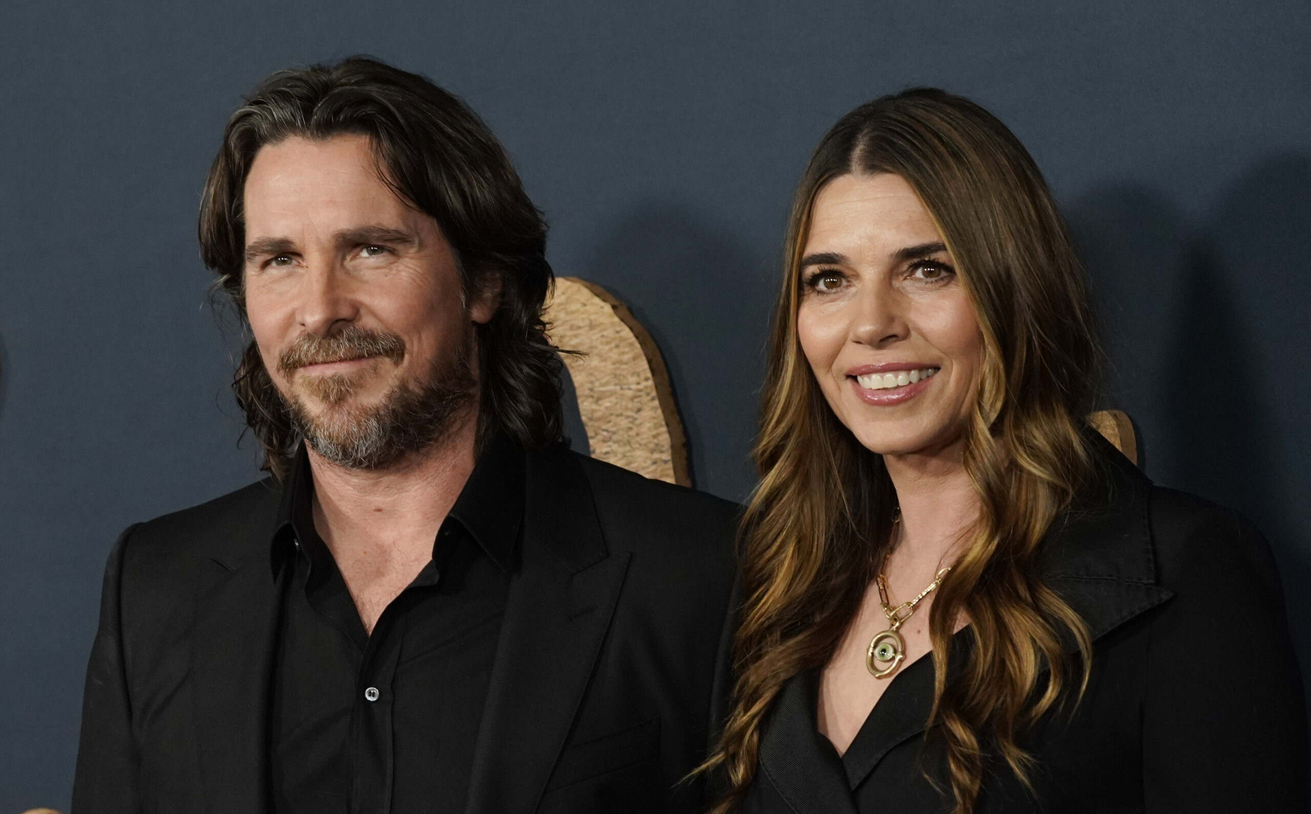 Christian Bale and his wife Sibi Blazic pose together at the premiere of the film "The Pale Blue Eye," Wednesday, Dec. 14, 2022, at the Directors Guild of America in Los Angeles. (AP Photo/Chris Pizzello)