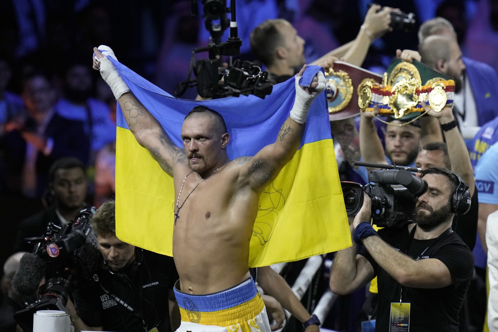 FILE - Ukraine's Oleksandr Usyk celebrates after beating Britain's Anthony Joshua to retain his world heavyweight title at King Abdullah Sports City in Jeddah, Saudi Arabia, on Aug. 21, 2022. Tyson Fury will face Oleksandr Usyk in Saudi Arabia in the first fight this century to unify all of the four major heavyweight boxing titles, Fury's promoter Frank Warren said Friday, Sept. 29, 2023. (AP Photo/Hassan Ammar, File)