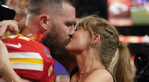 Taylor Swift kisses Kansas City Chiefs tight end Travis Kelce after the NFL Super Bowl 58 football game against the San Francisco 49ers, Sunday, Feb. 11, 2024, in Las Vegas. The Chiefs won 25-22 against the 49ers. (AP Photo/Brynn Anderson)