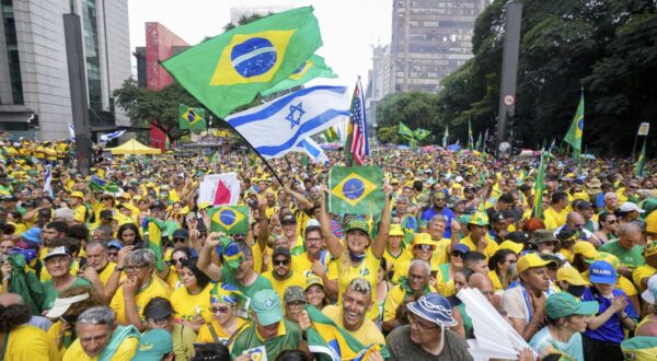 Followers of former Brazilian President Jair Bolsonaro rally to express their support for him in Sao Paulo., Brazil, Sunday, Feb. 25, 2024. Bolsonaro and some of his former top aides are under investigation into allegations they plotted a coup to remove his successor, Luis Inacio Lula da Silva. (AP Photo/Andre Penner)