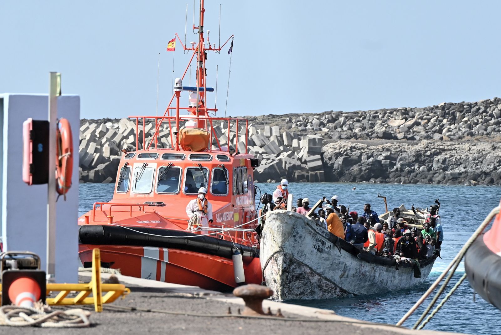 epa11114186 Migrants rescued by Spanish Salvamento Maritimo arrive at La Restinga port in El Hierro, Canary Islands, Spain, 30 January 2024. A total of 162 migrants were rescued when they traveled on board a small boat when trying to reach the Spanish coast.  EPA/Gelmert Finol