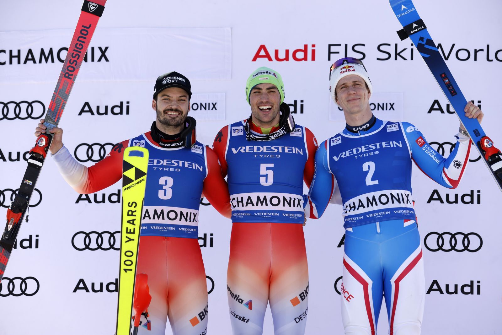 epa11125918 (L-R) Second placed Loic Meillard of Switzerland, first placed Daniel Yule of Switzerland and third placed Clement Noel of France celebrate on the podium after the Men's Slalom race at the FIS Alpine Skiing World Cup event in Chamonix, France, 04 February 2024.  EPA/SEBASTIEN NOGIER