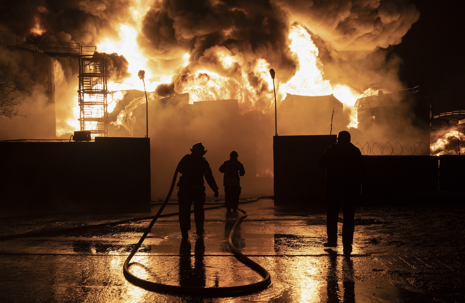 epaselect epa11142862 Firefighters work at the site of a fire after a drone strike on a oil depot in Kharkiv, northeastern Ukraine, 10 February 2024, amid the Russian invasion. At least seven people were killed, including three children, due to a fire after Russian shelling on the Nemyshlyan district of Kharkiv overnight 10 February, the chief of the local administration Oleh Syniehubov wrote on telegram.  EPA/YAKIV LIASHENKO
