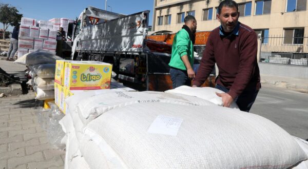 epa11144641 Workers load sacks with food as the non-governmental organization Egyptian Food Bank prepares food donations for Palestinians in the Gaza Strip, at a warehouse in New Cairo, Egypt, 11 February 2024. The Egyptian Food Bank gathers urgent food aid with basic food items for families in need in the Gaza Strip. The aid will be sent to Rafah border crossing. Since 07 October 2023, up to 1.9 million people, or more than 85 percent of the population, have been displaced throughout the Gaza Strip, some more than once, according to the United Nations Relief and Works Agency for Palestine Refugees in the Near East (UNRWA), which added that most civilians in Gaza are in 'desperate need of humanitarian assistance and protection'.  EPA/KHALED ELFIQI