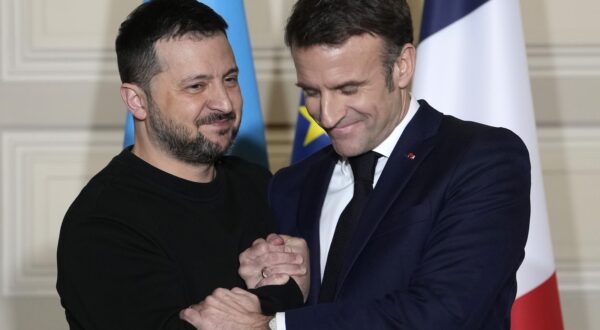 epa11159418 French President Emmanuel Macron (R) and his Ukrainian counterpart Volodymyr Zelensky shake hands after signing an agreement at the Elysee Palace in Paris, France, 16 February 2024. French President Emmanuel Macron will sign a bilateral security agreement with his Ukrainian counterpart, Volodymyr Zelensky to provide 'long-term support' to the war-ravaged country which has been battling Russia's full-scale invasion for nearly two years.  EPA/THIBAULT CAMUS / POOL MAXPPP OUT