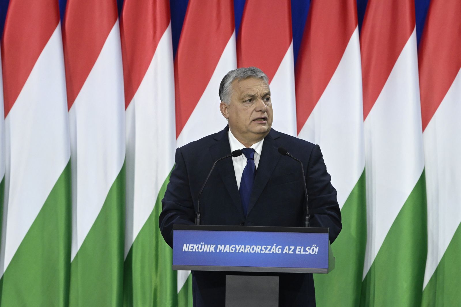 epa11160891 Hungarian Prime Minister Viktor Orban delivers his annual 'State of Hungary' address in Budapest, Hungary, 17 February 2024. The inscription on the podium reads: 'For us Hungary is the first!'.  EPA/SZILARD KOSZTICSAK HUNGARY OUT